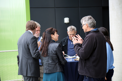 event attendees talking outside.png